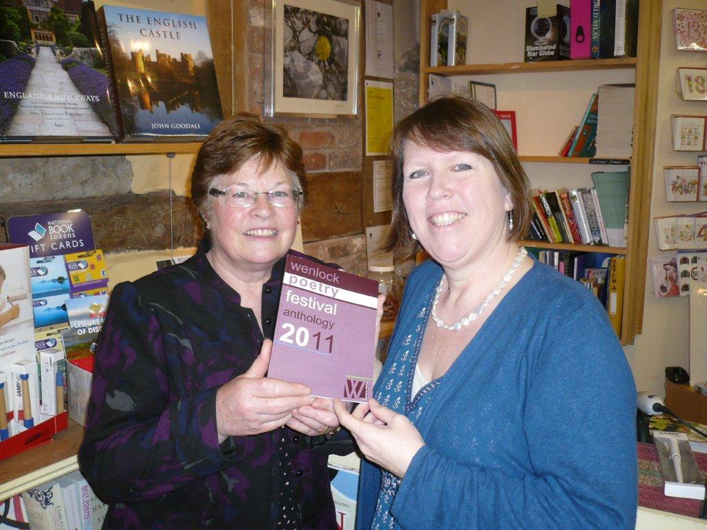 Anna Dreda of Wenlock Books and Wenlock Poetry Festival Committee and Ina Taylor of Ellingham Press hold the Wenlock Festival Poetry Anthology 2011